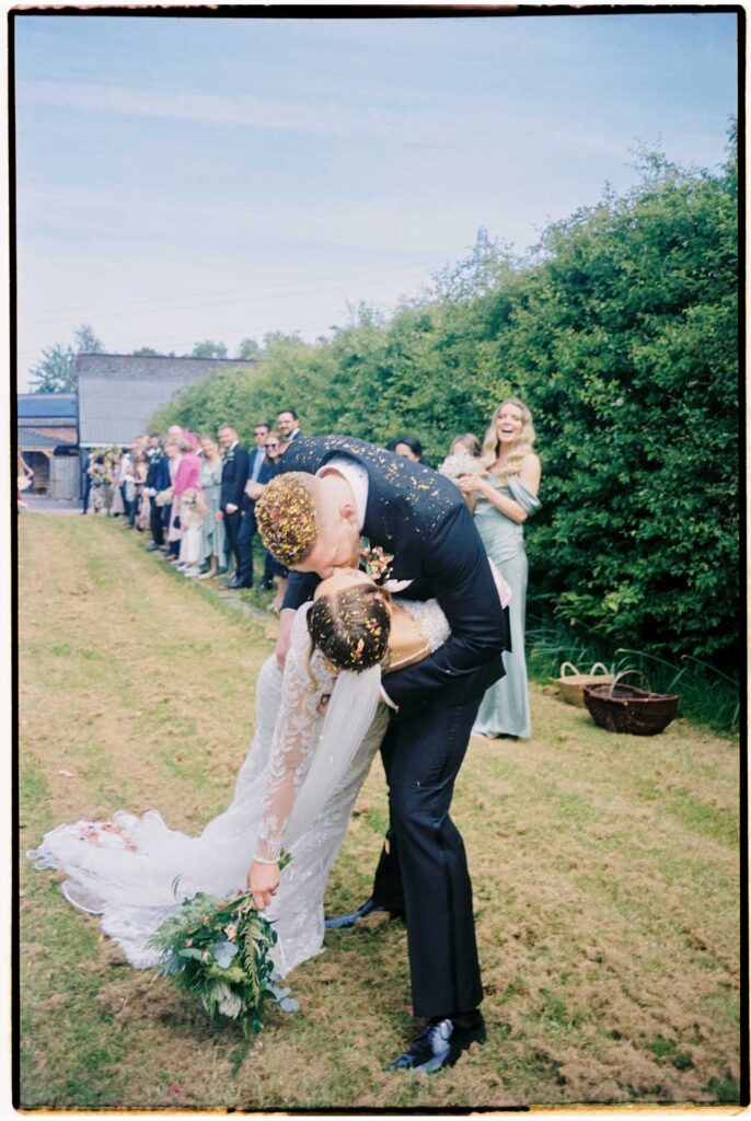 35mm wedding kiss portrait