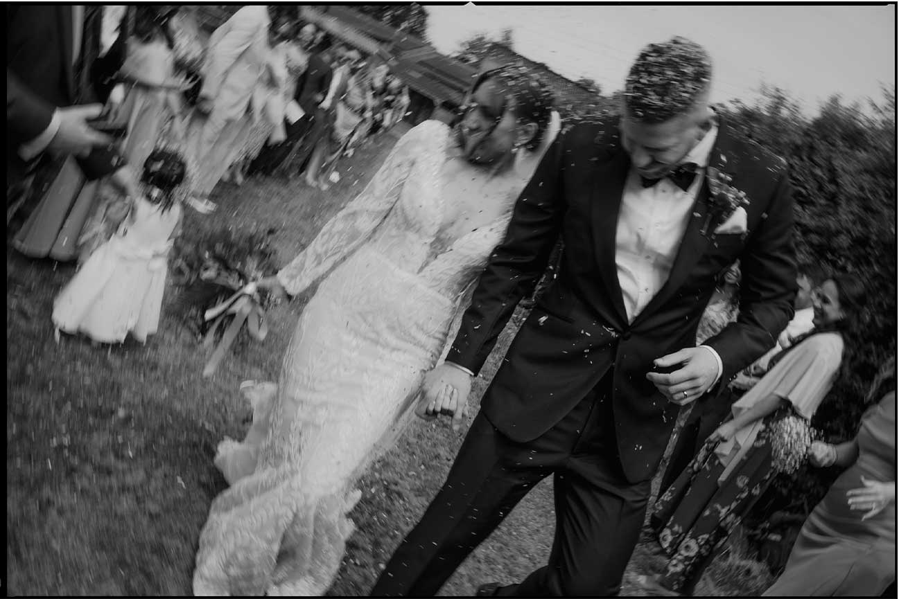 mono wedding portrait with confetti