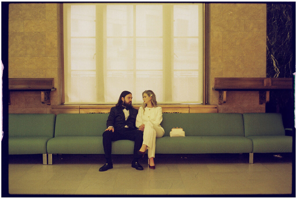 Film wedding photographer captures cinematic New York elopement at City Clerk’s Office, minimal and romantic ceremony.