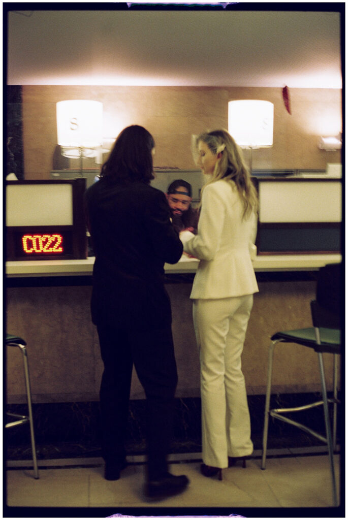 Film wedding photographer captures cinematic New York elopement at City Clerk’s Office, minimal and romantic ceremony.