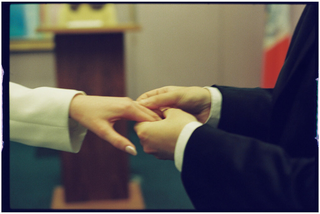 Film wedding photographer captures cinematic New York elopement at City Clerk’s Office, minimal and romantic ceremony.