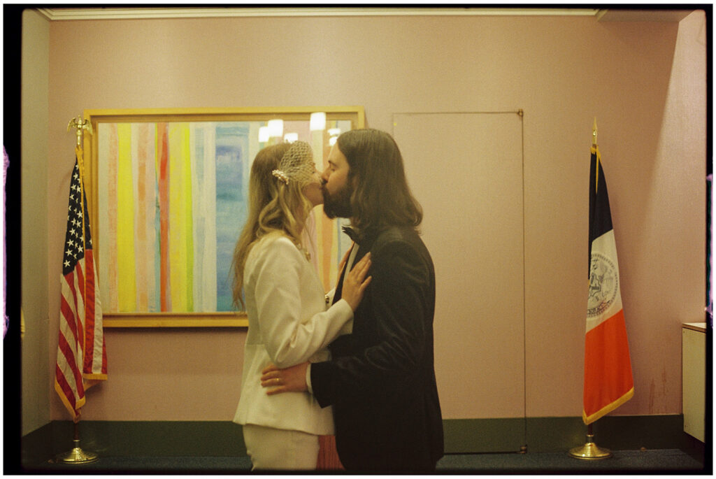 Film wedding photographer captures cinematic New York elopement at City Clerk’s Office, minimal and romantic ceremony.