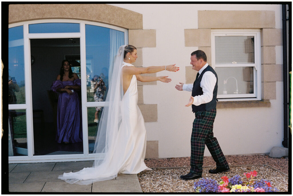Bride and groom captured on film during their Kinkell Byre wedding in St Andrews, Scotland