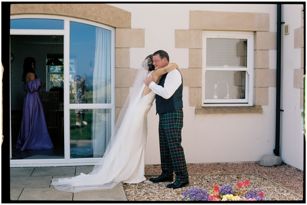 Bride and groom captured on film during their Kinkell Byre wedding in St Andrews, Scotland