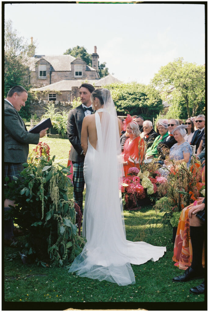 Bride and groom captured on film during their Kinkell Byre wedding in St Andrews, Scotland