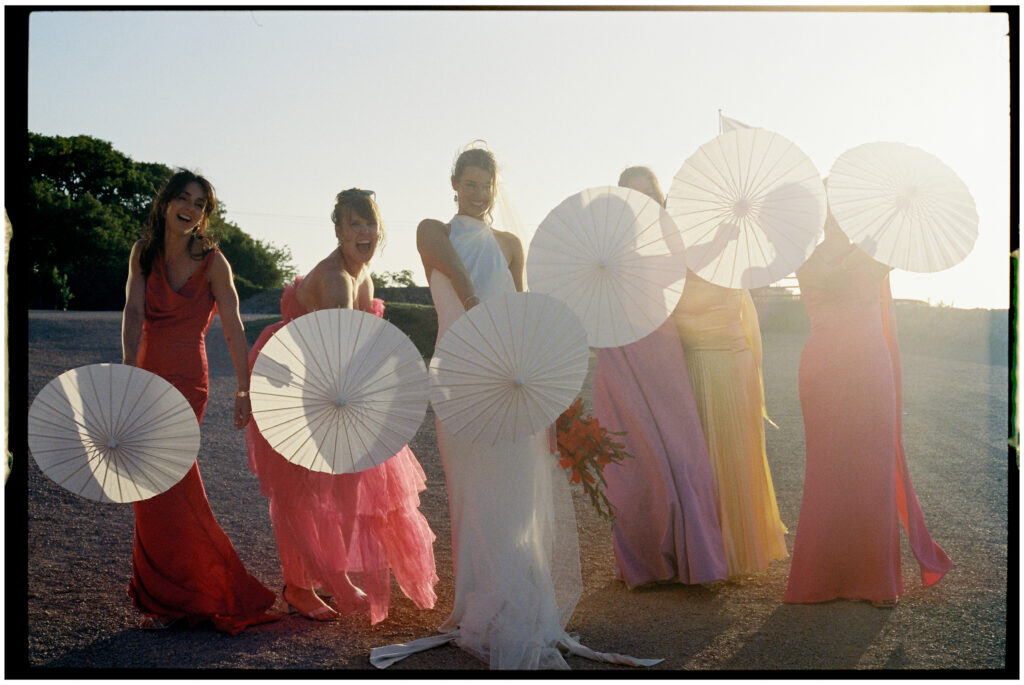 Bride and bridesmaids in colourful dresses -Kinkell Byre wedding shot on film