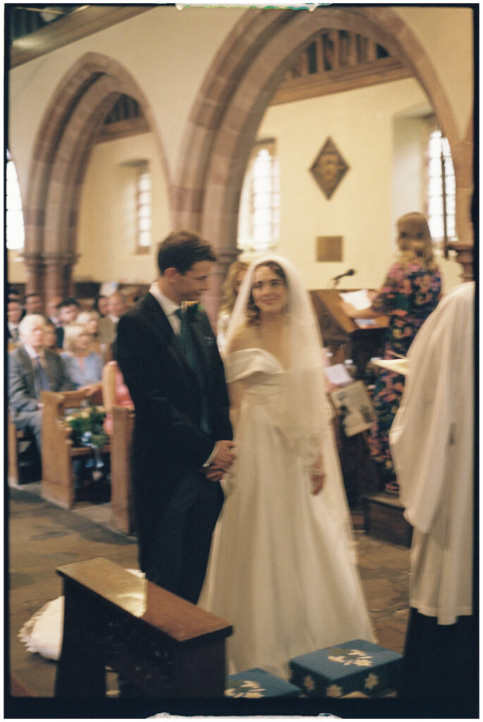 Couple getting married in a Church in Shropshire shot on 35mm film photography 
